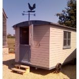 A SHEPHERD'S HUT double glazed and fully insulated, 396.24cm in length x 266cm wide x 251cm high,