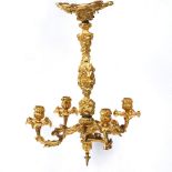 A GILT ORMOLU FOUR BRANCH HANGING ELECTROLIER OR CHANDELIER with cast naturalistic cast rococo