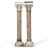 A PAIR OF VICTORIAN CARVED WHITE AND VEINED MARBLE ARCHITECTURAL COLUMNS with scroll decorated