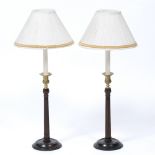 A PAIR OF MAHOGANY AND BRASS TABLE LAMPS in the Georgian style with fluted column supports and