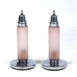 A PAIR OF ART DECO CHROME PLATED TABLE LAMPS with fluted pink glass and cylindrical shades beneath