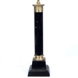 AN EMPIRE STYLE BLACK PAINTED TABLE LAMP in the form of a column on a square base, the base 18.5cm