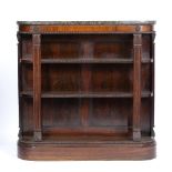 A REGENCY ROSEWOOD BOOKCASE with shaped front beneath a marble top and fluted pilaster column