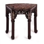 A CHINESE HARDWOOD SHAPED STAND with marble inset top and foliate mother of pearl inlay, fretwork