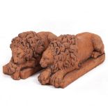 A PAIR OF CONTEMPORARY CAST TERRACOTTA RECUMBENT LIONS in the manner of Canova, each 32cm long x