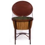 A 19TH CENTURY OVAL MAHOGANY WORKTABLE the lifting lid revealing a cloth lined wool basket within,