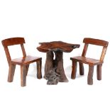 A TEAK ROOT GARDEN TABLE the top approximately 82cm wide x 95cm deep x 75cm high together with two