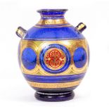AN EARLY 20TH CENTURY TWIN HANDLED PORTUGUESE BLUE SPECKLED VASE with the head of 'Vinucis Dux