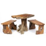 A TEAK ROOT GARDEN TABLE 91cm wide x 52cm deep x 70cm high together with two teak root benches, each