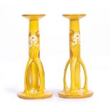 A PAIR OF 19TH CENTURY ART NOUVEAU ROYAL BON CANDLE STICKS of yellow ground, decorated with white