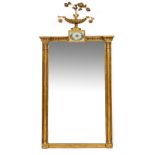 A REGENCY GILT OVERMANTLE OR PIER MIRROR with decorative flower filled vase cresting over a verre