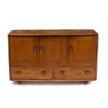 AN ERCOL LIGHT ELM SIDEBOARD with three panelled doors above two drawers, raised on easyroll