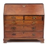 A GEORGE III MAHOGANY BUREAU with fitted interior, with two short and three long drawers standing on