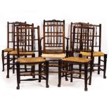A GROUP OF SIXTEEN MATCHED NORTH COUNTRY SPINDLE BACK DINING CHAIRS with rush seats and club feet, a