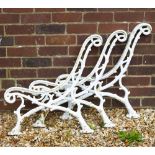 A SET OF THREE VICTORIAN CAST IRON BENCH SUPPORTS naturalistically cast as branches, each section
