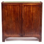 A 19TH CENTURY MAHOGANY SIDE CABINET with green baize inset top, panelled doors enclosing two