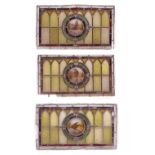 A SET OF FOUR VICTORIAN STAINED GLASS ROUNDELS decorated with birds, within circular borders, the