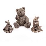 A CONTEMPORARY FILLED HALLMARKED SILVER SCULPTURE of a teddy bear, 11cm high together with two