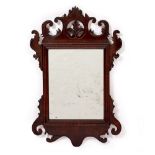 A GEORGIAN MAHOGANY VENEERED FRET FRAMED WALL MIRROR 33.5cm wide x 51cm high Condition: minor loss