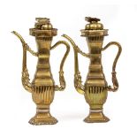 A PAIR OF ANTIQUE CHINESE BRASS WINE EWERS of hexagonal section, each spout cast with a dragons