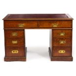 A MID 20TH CENTURY OAK PEDESTAL DESK with leatherette inset top and inset brass handles to the oak