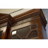 A GEORGE III STYLE MAHOGANY BREAKFRONT LIBRARY BOOKCASE late 20th century in manufacture, with