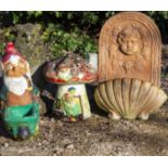 A PAINTED AND CAST RECONSTITUTED STONE GARDEN ORNAMENT in the form of a toadstool, the home to two