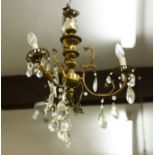 A MID 20TH CENTURY BRASS THREE BRANCH ELECTROLIER OR CHANDELIER with cut glass drops Condition: some