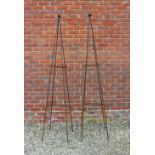 A PAIR OF WROUGHT IRON CONICAL GARDEN OBELISKS with ball finials, 204cm high (2) At present, there