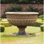 A VICTORIAN LARGE BUFF TERRACOTTA URN OR FOUNTAIN BOWL with guilloche banding and fluted