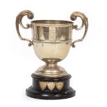 AN EARLY 20TH CENTURY SILVER TROPHY CUP with scrolling handles and later engraved 'British Legion,
