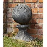 A RECONSTITUTED STONE BALL FINIAL on a square spreading base, 66cm high Condition: usual minor marks