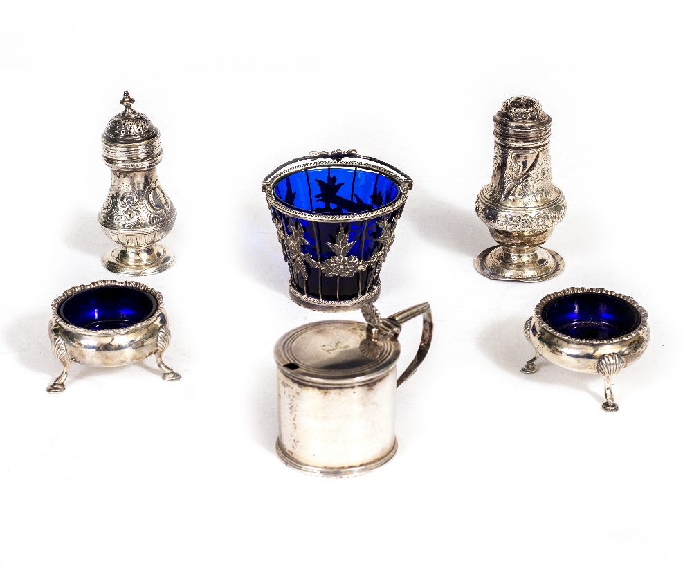 A WILLIAM IV DRUM MUSTARD POT with stags head crest and shell cast thumb piece, with blue glass