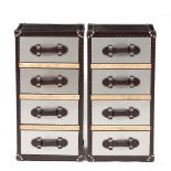 A PAIR OF MODERN FOUR DRAWER BEDSIDE CABINETS in the form of luggage cases, each 41cm wide x 33cm