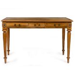 A FRENCH STYLE HARDWOOD DESK with leather inset top, three frieze drawers and standing on turned