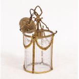A SMALL 20TH CENTURY CAST BRASS HALL LANTERN of cylindrical form with cut glass panels and