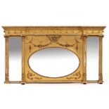 AN EARLY 20TH CENTURY GILT BREAKFRONT OVERMANTLE MIRROR in a classical style with central oval