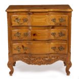 A CONTINENTAL PINE SERPENTINE CHEST OF THREE DRAWERS with carved cabriole legs, 83.5cm wide x 46.5cm