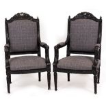 A PAIR OF 18TH CENTURY FRENCH STYLE BLACK PAINTED OPEN ARMCHAIRS with grey overstuffed