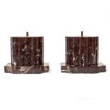 A PAIR OF ROUGE MARBLE SCULPTURE STANDS OR PLINTHS in the form of fluted cylinders on shaped