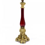 A GILT METAL AND FACETED RED GLASS TABLE LAMP 60cm in height At present, there is no condition