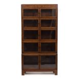 AN OAK MINTY LIMITED FIVE SECTION BOOKCASE each section with twin glazed doors, all raised on