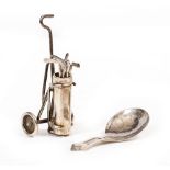 AN ELIZABETH II MINIATURE NOVELTY SILVER GOLF TROLLEY BAG AND FIVE CLUBS by Edward Victor Stanley