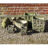 A PAIR OF SMALL RUSTICATED CONCRETE GARDEN PLANTERS 30cm wide x 34cm high together with a circular