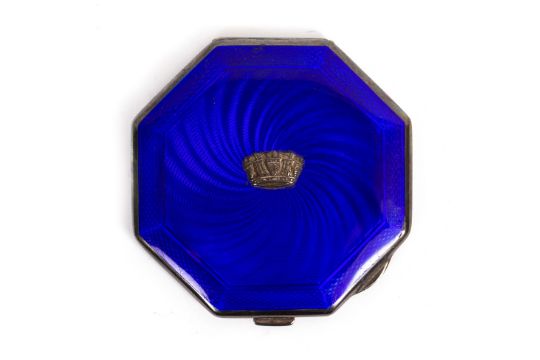 A 1930s BLUE ENAMEL AND ENGINE TURNED SILVER COMPACT of octagonal form with a central crest, - Image 1 of 4