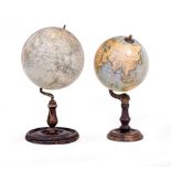 A PHILLIPS EDUCATIONAL TERRESTRIAL GLOBE 20cm diameter and mounted on a turned ebonised base,