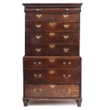 A GEORGE III OAK CHEST ON CHEST the frieze drawer with later turned knob handles, possibly with