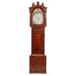 AN EARLY 19TH CENTURY OAK AND MAHOGANY EIGHT DAY LONGCASE CLOCK the 14 1/4" painted arched Roman