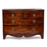 A BOW FRONTED MAHOGANY CHEST OF TWO SHORT AND TWO LONG DRAWERS standing on bracket feet, 107.5cm