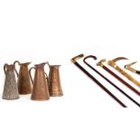 FIVE WALKING STICKS to include carved antler and brass handles, four brass jugs one stamped 3S&S